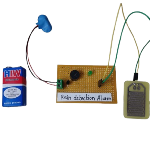 Circuit diagram of a DIY rain alarm project using a rain sensor, NPN transistor, and buzzer to detect water droplets.
