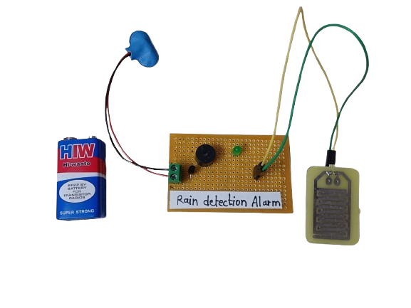 Circuit diagram of a DIY rain alarm project using a rain sensor, NPN transistor, and buzzer to detect water droplets.